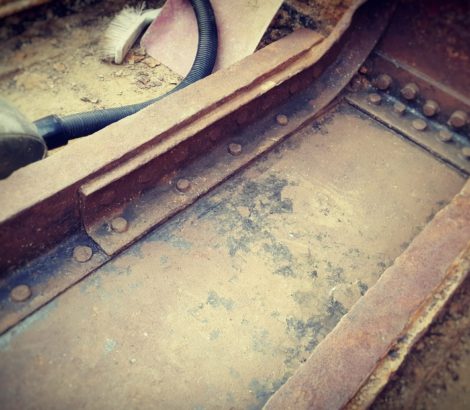 Rust removal from Thames barge