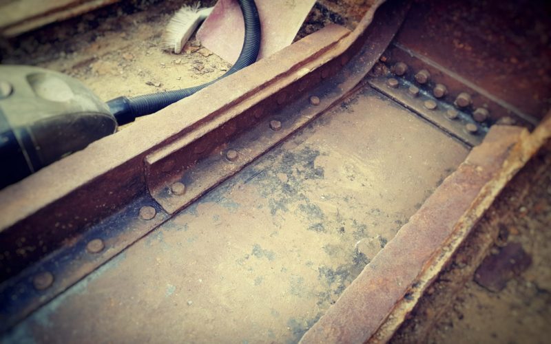 Rust removal from Thames barge