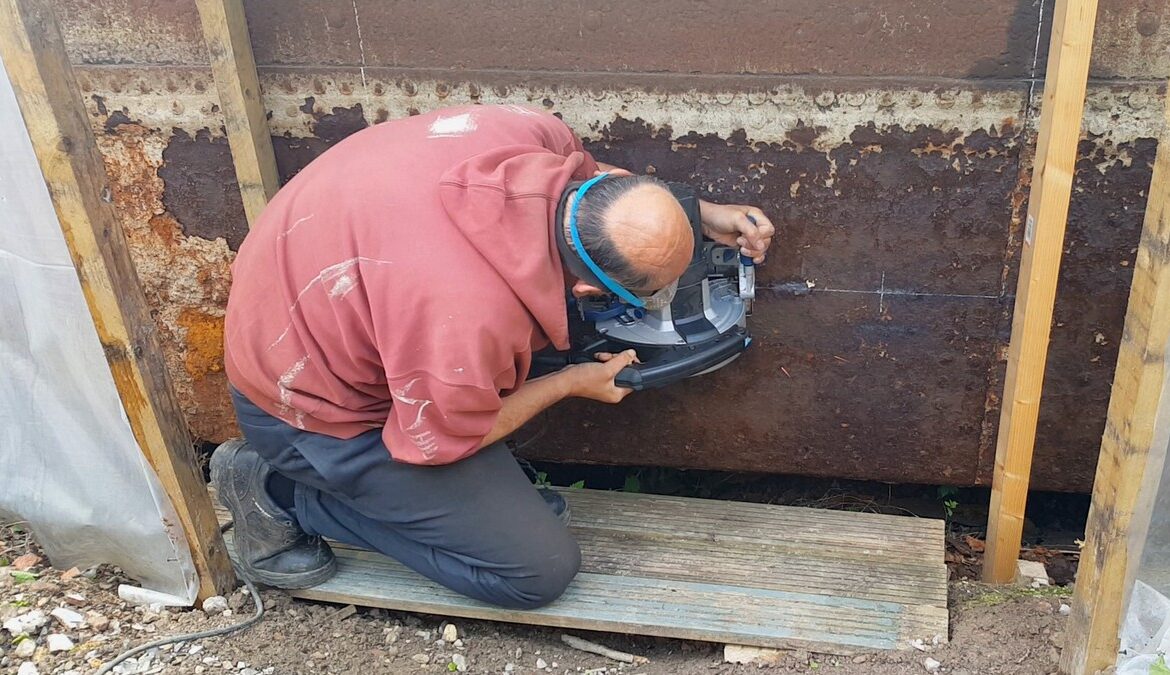 Cutting out a barge door